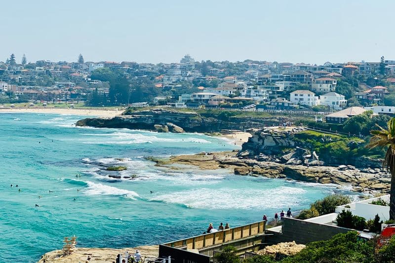 Coastal walk view south from Bondi showing Tamarrama Beach midground and Bronte Beach in background with Sydney suburbs